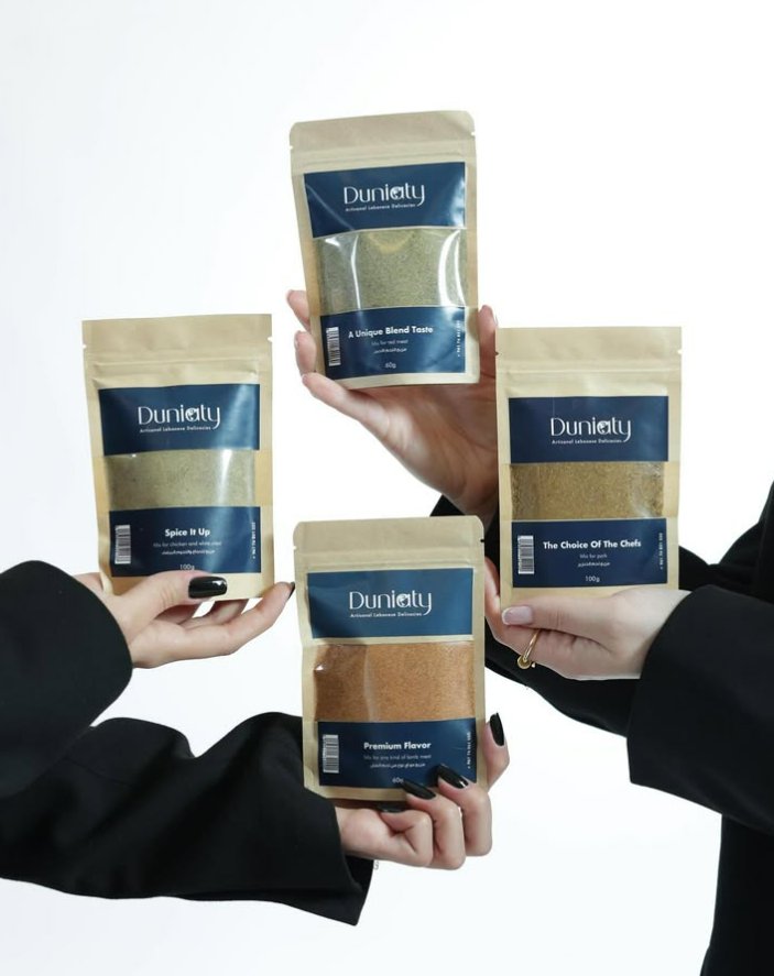 Four Duniaty spice blends held up together
